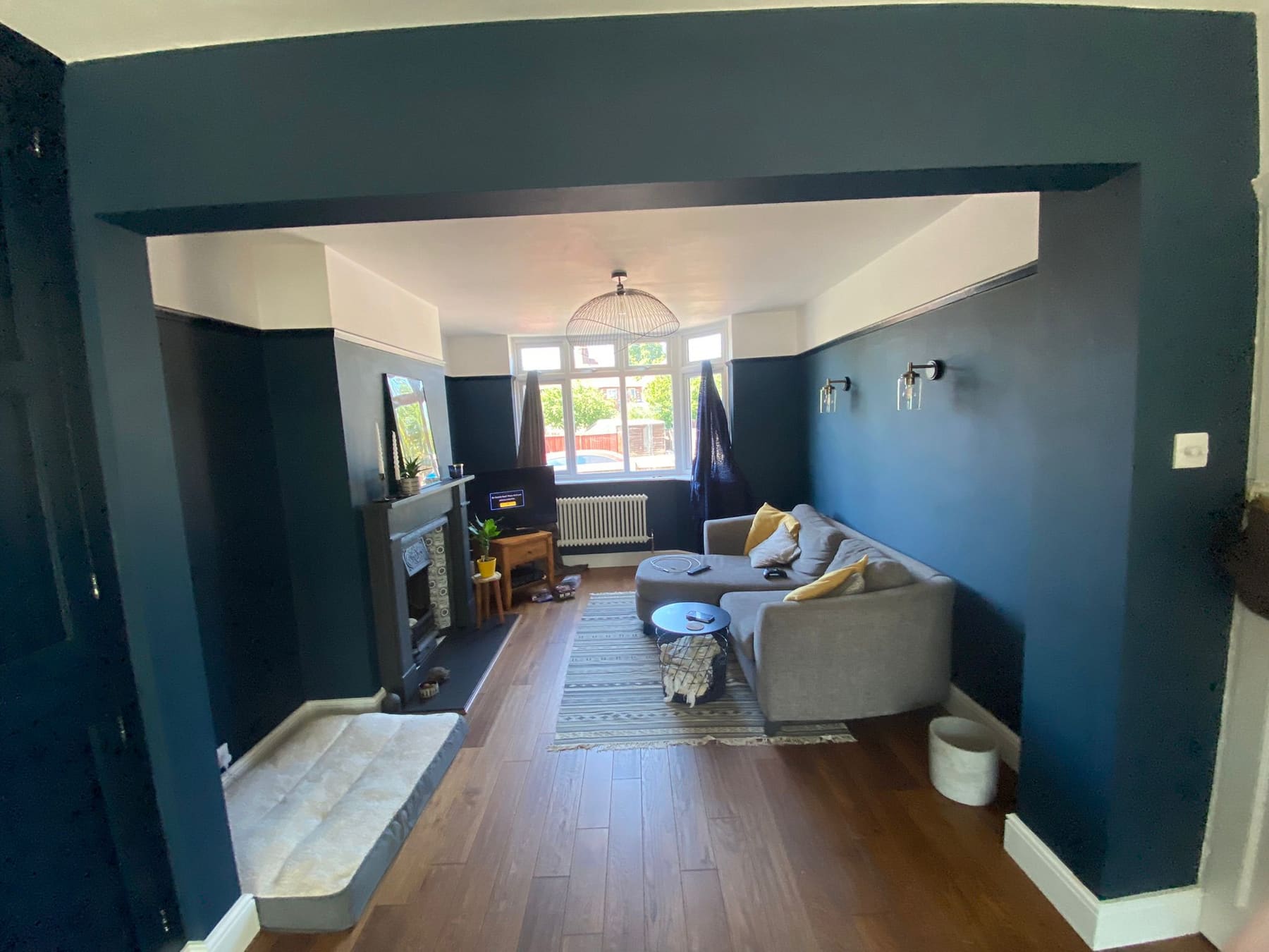 Finished lounge seen through a new structural opening
