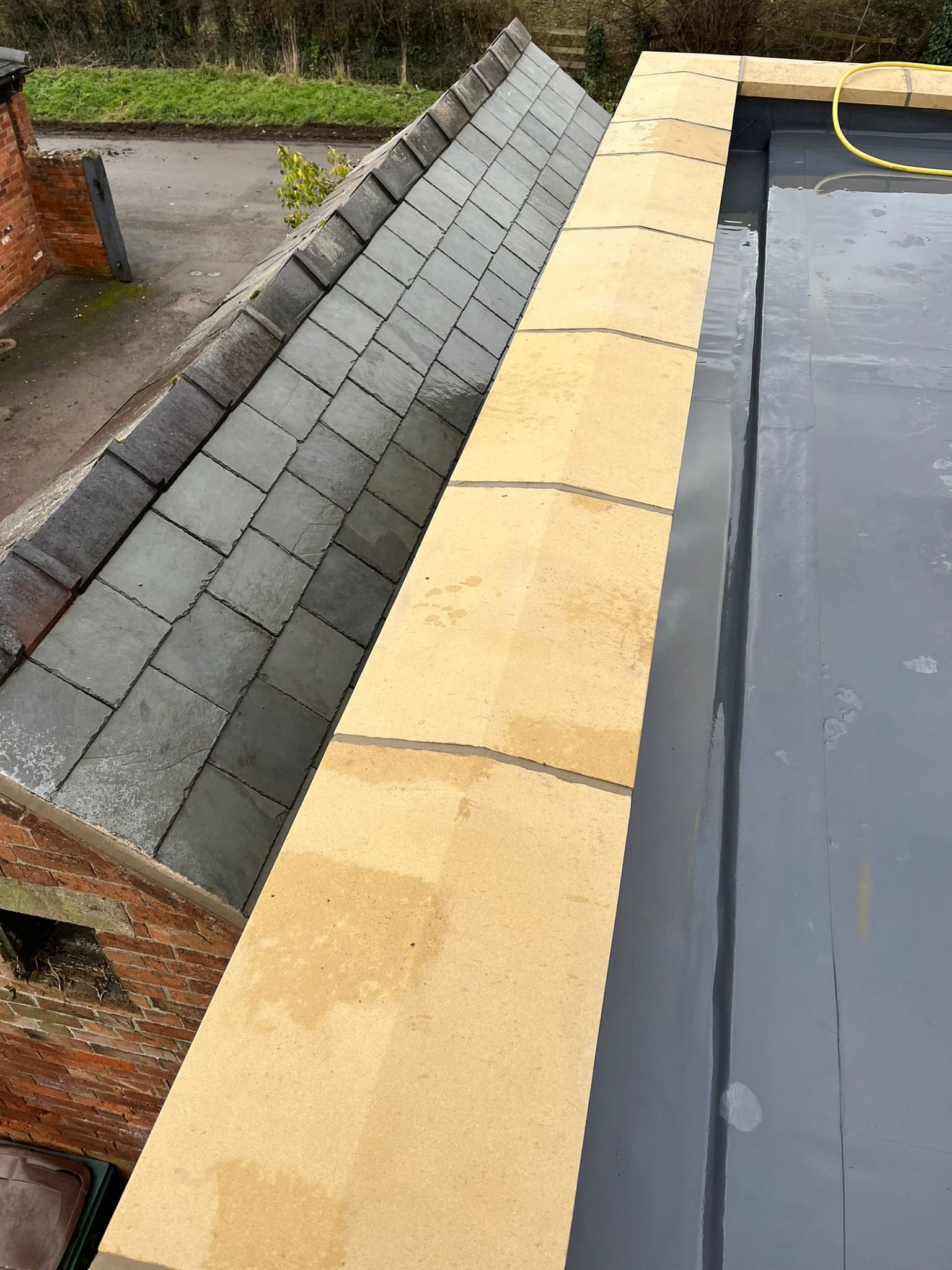 New roof work meeting the existing slate pitch